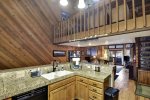 Spacious kitchen looking over dining and living areas